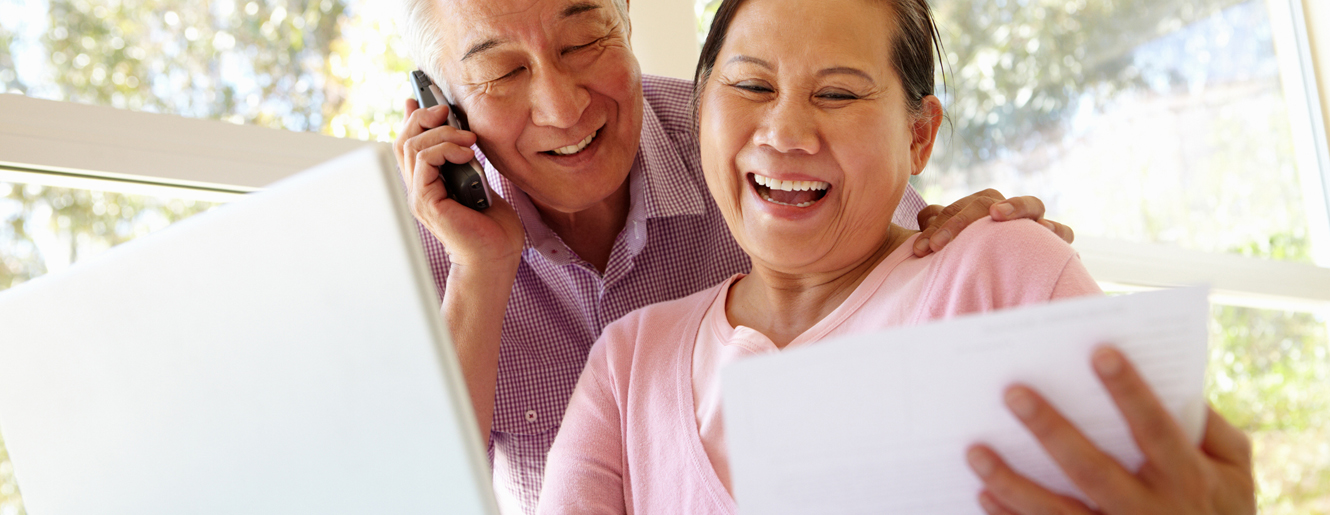 Mature couple at a computer.
